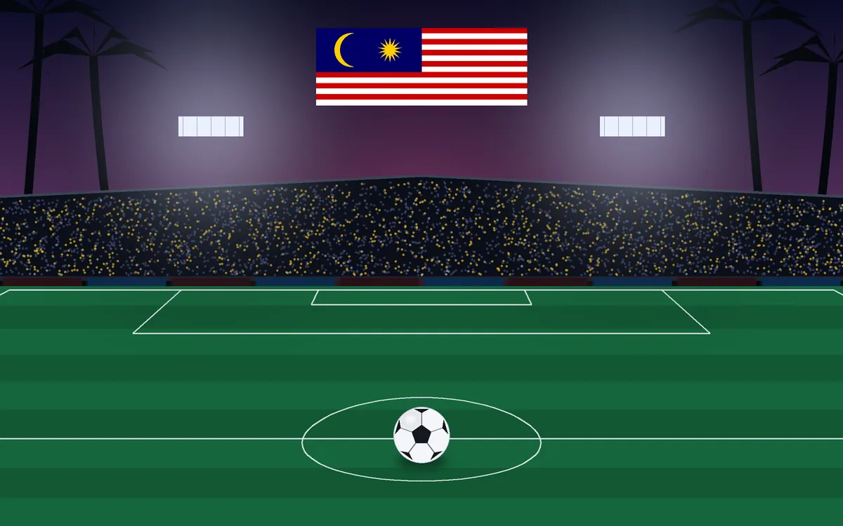 Stadium at dusk with palm silhouettes and a Malaysian flag