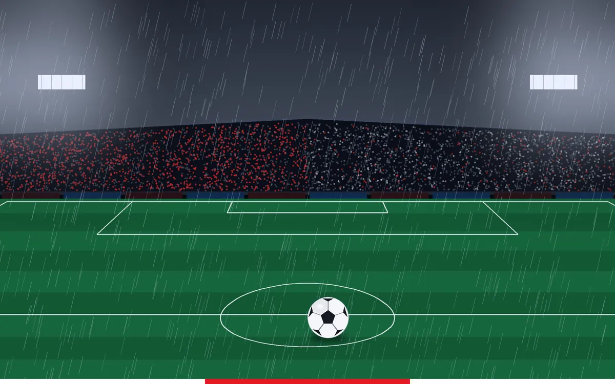 Rainy floodlit stadium with red and white home fans